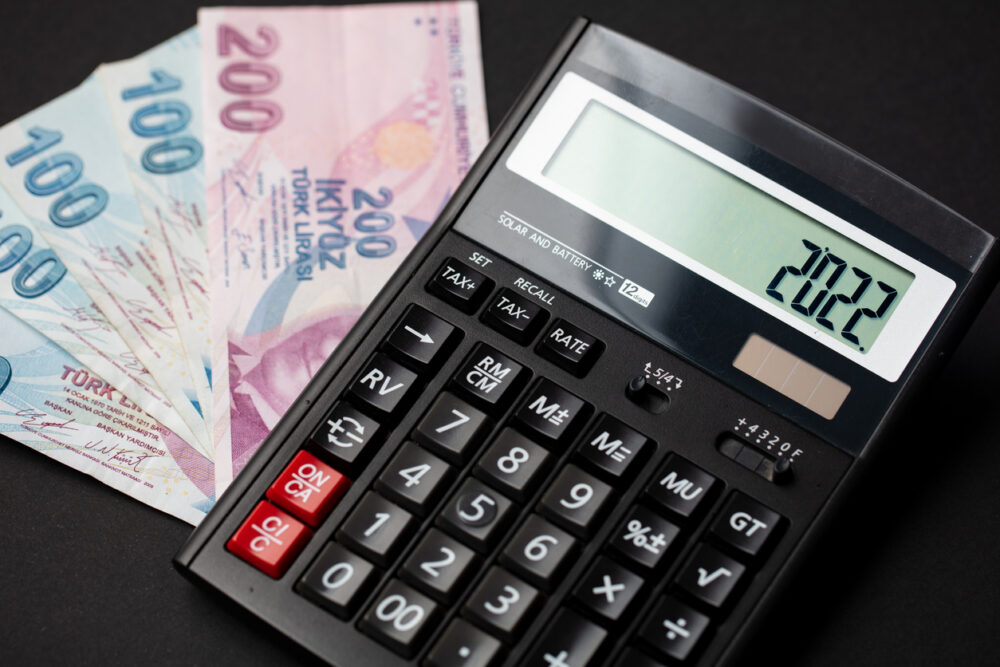 2022 with a calculator and Turkish lira banknotes, the concept of new year money, finance and budget in Turkey.